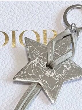 DIOR silver Star Keychain with White Map Detailing and leather strap